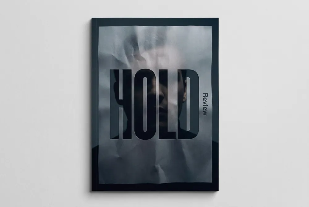 Editorial portrait behind frosted crumpled paper, ominous silhouette barely visible, bold HOLD typography overlay, navy palette