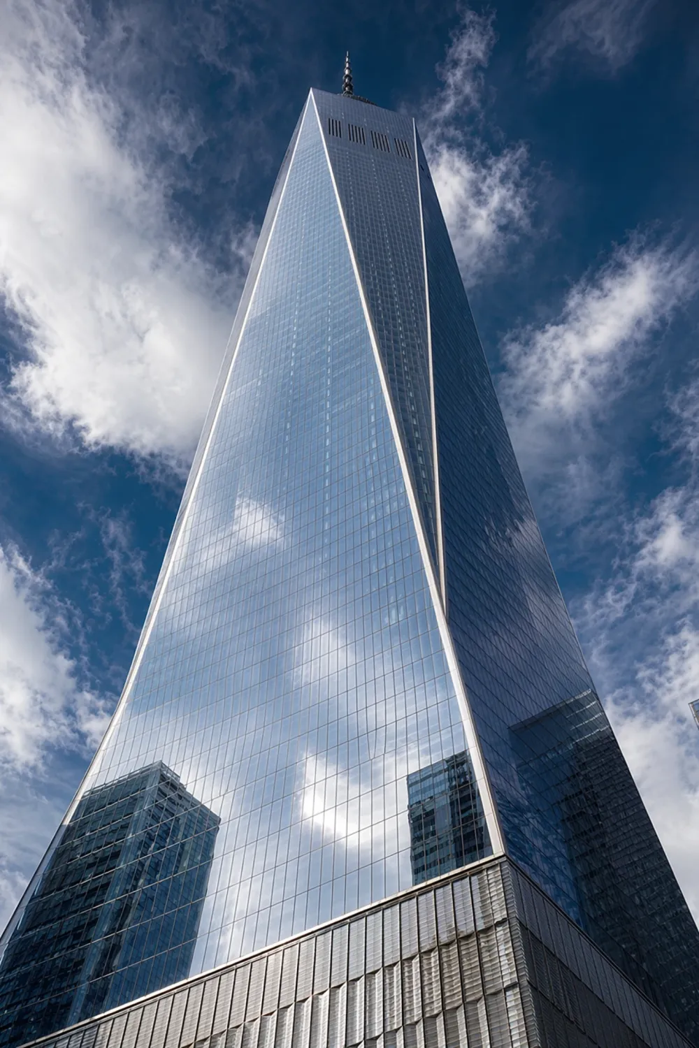 AI worm’s-eye view of a glass skyscraper from street level